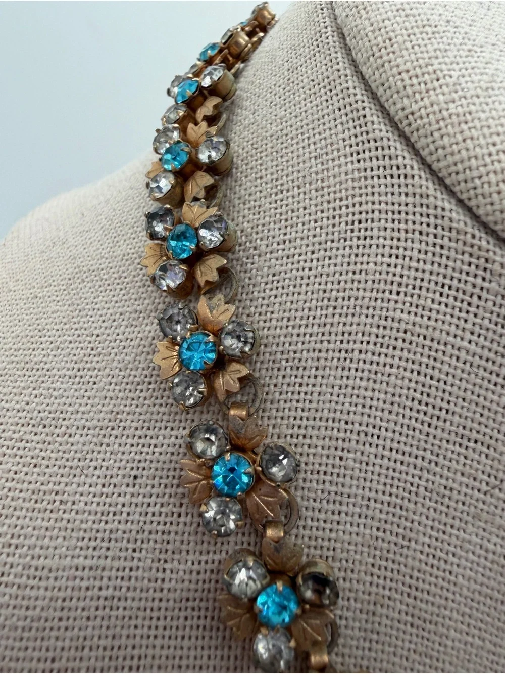 Vintage gold tone blue and clear rhinestone flower necklace